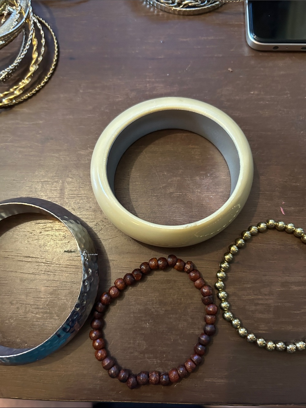 Set of 4 bracelets. 2 bangles and 2 stretch
